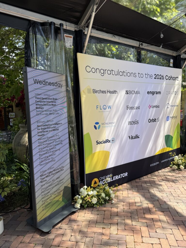 One Mind Accelerator 2026 cohort banner and digital agenda signage at Allied Arts Guild