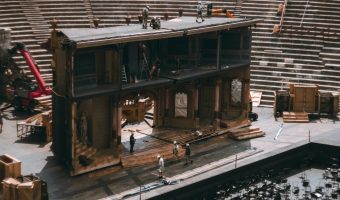scenic-design-wooden-house-set-pieces Custom wooden house set piece on stage created by WestWave AV scenic design team.